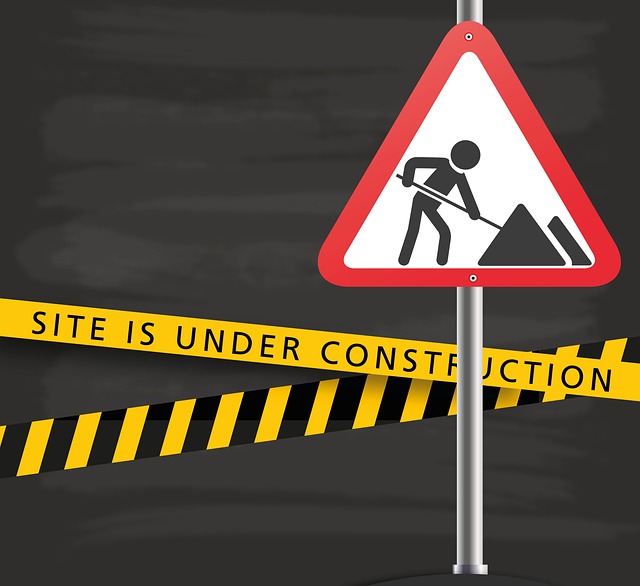 Graphic of a road sign and construction ribbon tape that says "Site Is Under Construction".